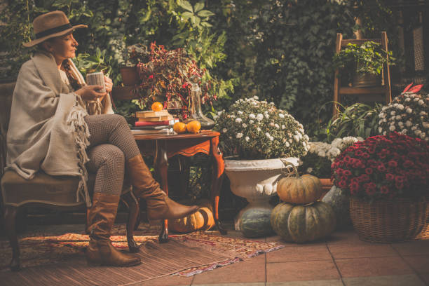 istock Woman enjoying sunny day in back yard 1080359310