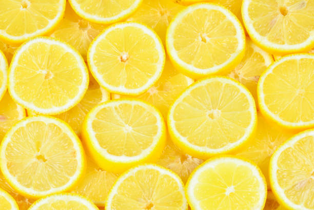 istock A slices of fresh juicy yellow lemons.  Texture background, pattern. 1080359332