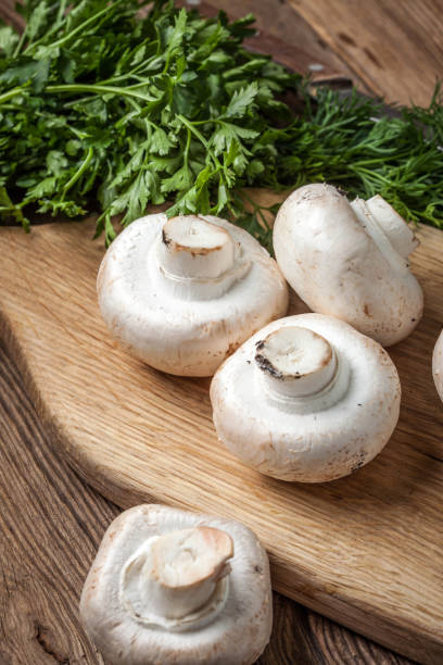 istock Fresh mushrooms on cutting board. 1080359618