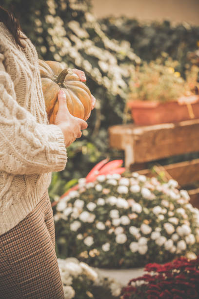 istock Woman decorating back yard in autumn 1080360058