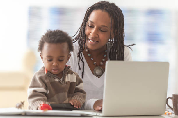 istock A mother works from home with her young son 1080366044