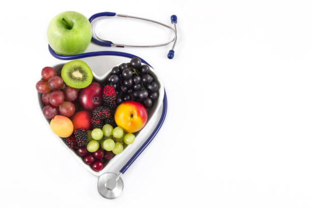 istock Fresh Fruits in Heart Shaped Bowl with Stethoscope 1080368514