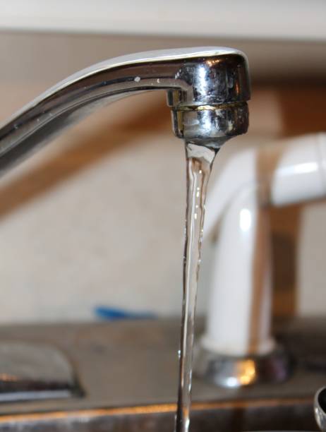 istock Kitchen faucet with running water 1080371902
