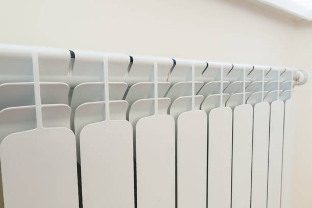 istock White aluminum radiator heating panel in the interior 1080377224