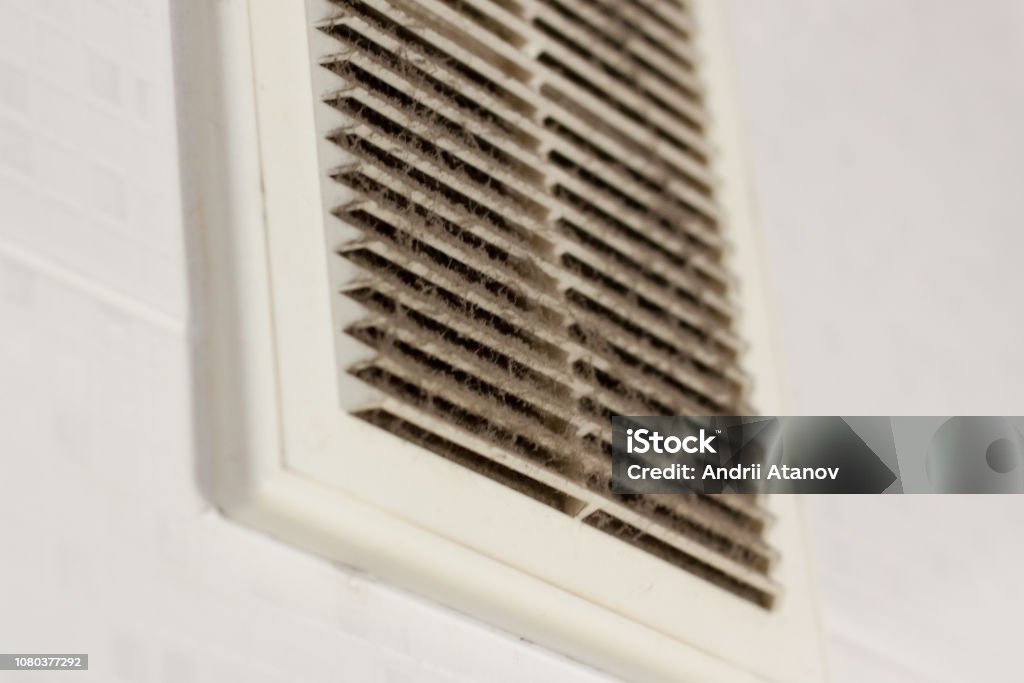 cleaning ventilation plastic dust. the filter is completely clogged with dust and dirt. dirty ventilation in the room. Disinfection service. Air Duct Stock Photo