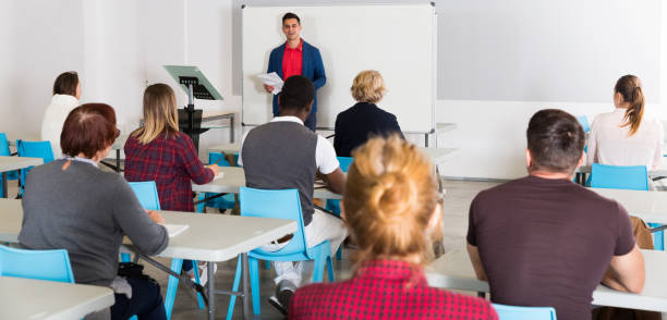 istock Male student answering at whiteboard 1080378730