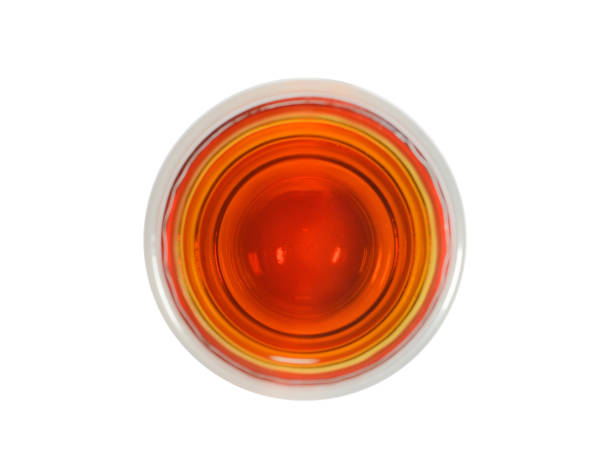 shot glass of whisky the top view on a white background - shot glass imagens e fotografias de stock
