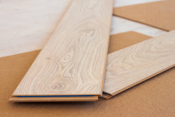 istock Laminate floor planks crossed renovation concept 1080384666
