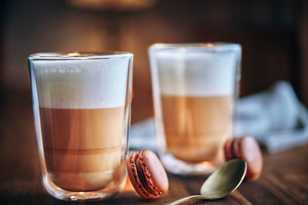 Latte Macchiato Served with Macarons Latte Macchiato Served with Macarons cafe macchiato stock pictures, royalty-free photos & images