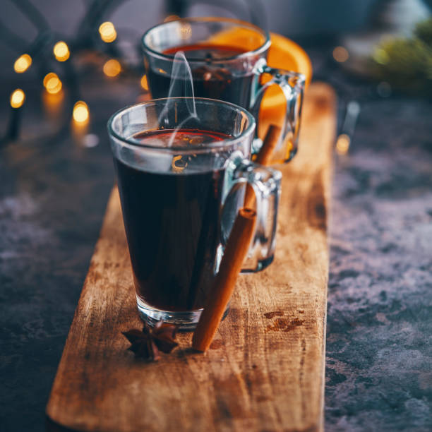 Mulled Wine with Orange, Cinnamon, Star Anise and Spices for Christmas Mulled Wine with Orange, Cinnamon, Star Anise and Spices for Christmas mulled wine photos stock pictures, royalty-free photos & images