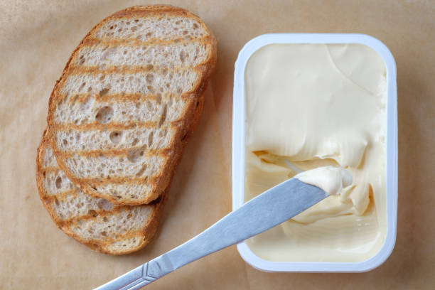 istock Sliced bread toast cream cheese, top view 1080392362