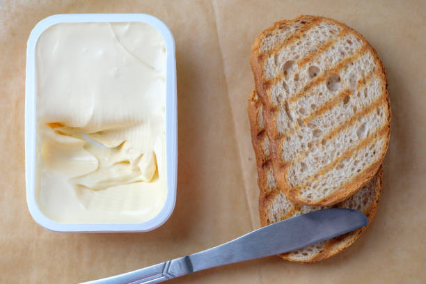 istock Sliced bread toast cream cheese, top view 1080393230
