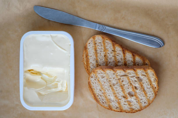 istock Sliced bread toast cream cheese, top view 1080393560