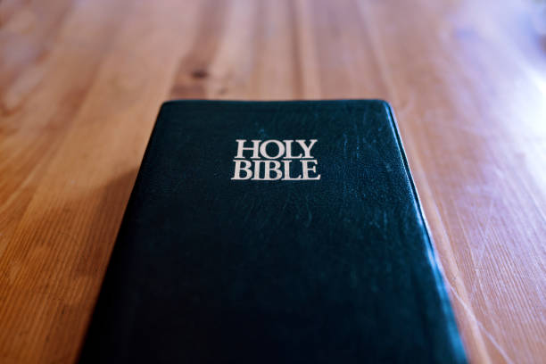 istock Holy Book on Wooden Table 1080395738