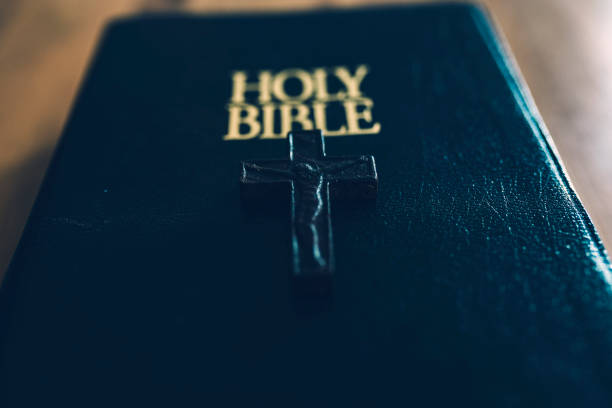 istock Holy Book on Wooden Table 1080395746