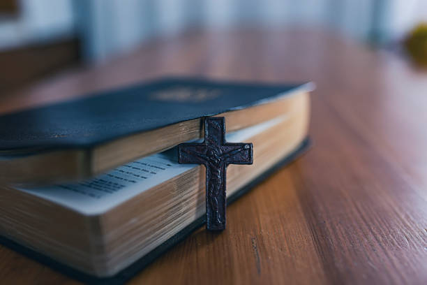 istock Holy Book on Wooden Table 1080395814