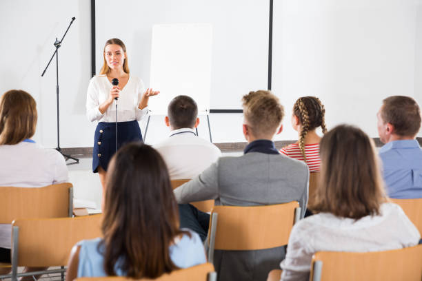 istock Female coach giving presentation for audience 1080395988