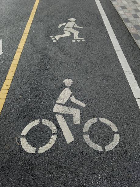 istock Bike lane illustrations with cyclist and rollerblader imagery 1080398358