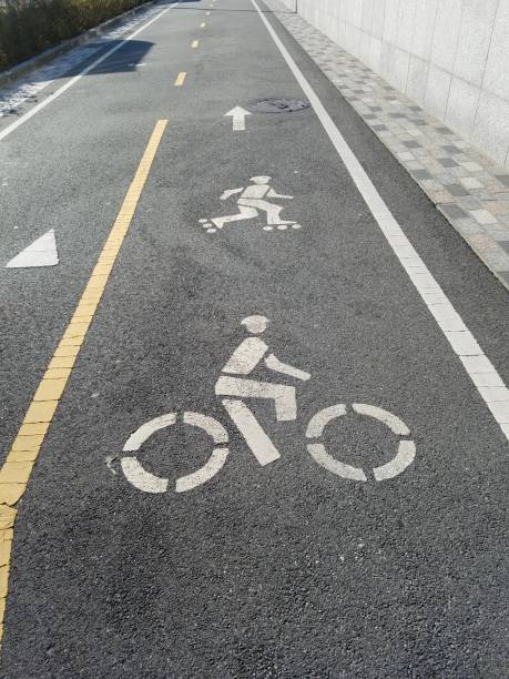 istock Bike lane illustrations with cyclist and rollerblader imagery 1080398362