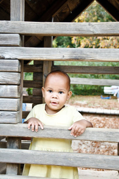 istock Welcome to my castle: Child Playing In A Wooden Playhouse 1080406446