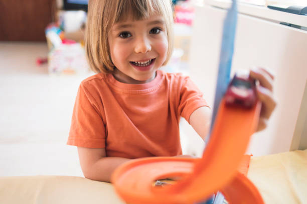 istock Child playing with toys at home 1080407574