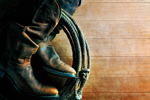 istock Old Cowboy Boots And Lasso 1080408254