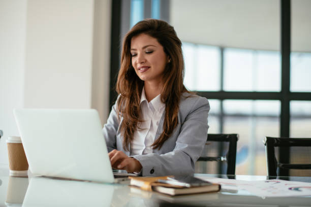 istock Beautiful young woman working in her office 1080412480