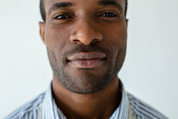 istock Confident afro americn man standing against white background 1080412896