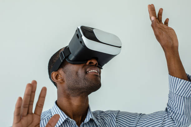 istock Close up of cheerful afro americn man testing VR device 1080415088