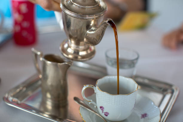 istock Pouring mocca coffee in an old small porcelain cup 1080415318