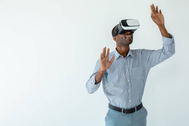 istock Smiling afro american businessman testing VR device 1080415934
