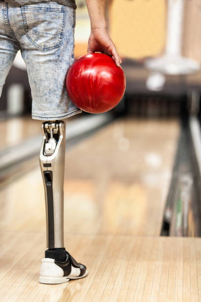 istock Man with artificial leg prepares to bowl a strike 1080423834