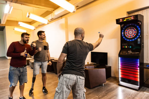 istock Men playing darts in pool hall 1080424586