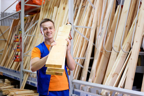 istock worker or seller in construction store or warehouse wood section at work 1080426360