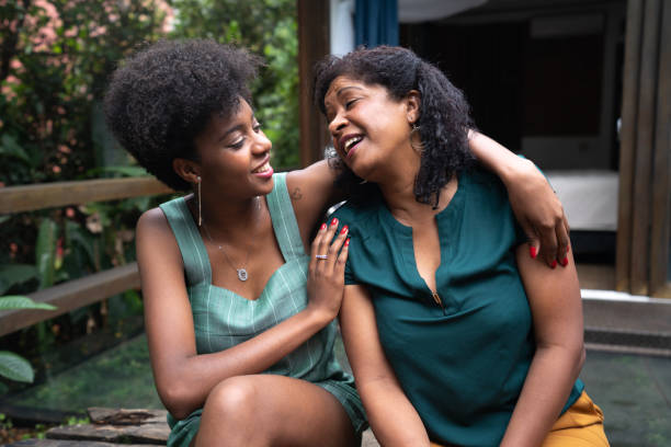 Mother and Daughter Embracing at Home