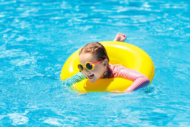 child in swimming pool. kids swim. water play. - 16605 imagens e fotografias de stock