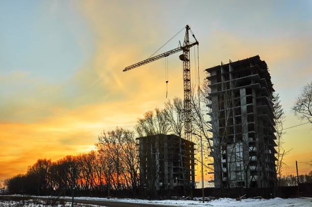istock Construction house at dusk evening yellow light, crane 1080428918