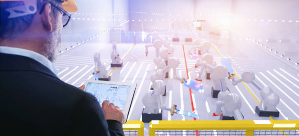 istock Smart automation industry robot in action welding metall while engineer uses his remote control table pc 1080431936