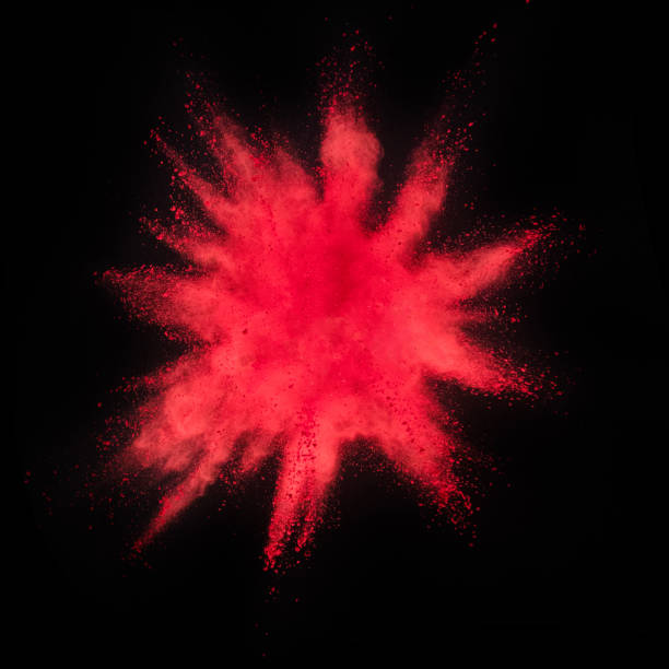 istock Explosion of red powder on black background 1080453526