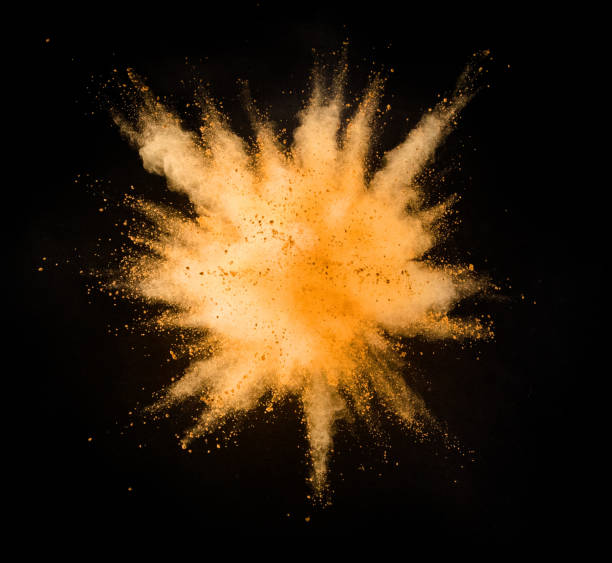 istock Explosion of yellow powder on black background 1080453614