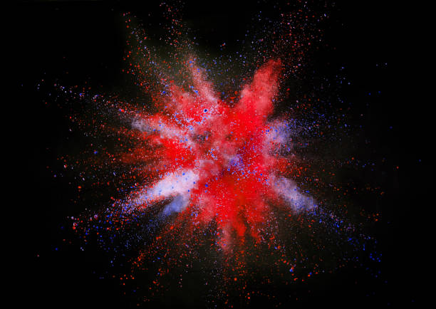 istock Explosion of yellow powder on black background 1080453696