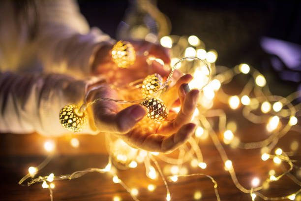 istock Woman holding Christmas lights 1080466366