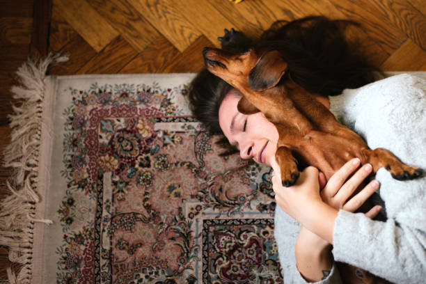 istock Woman cuddling with her dog 1080475480