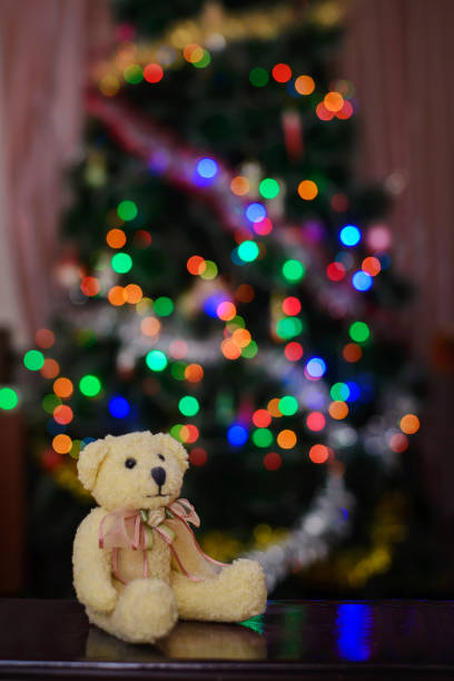 istock Christmas Teddy bear near Christmas tree in lights 1080481972