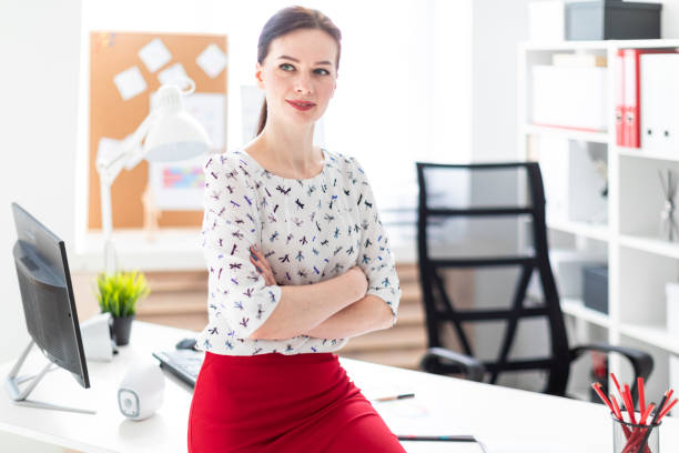 istock A young girl sat down on a table in the office. 1080494250