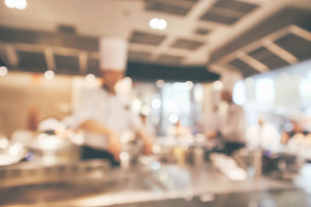 istock Chef cooking in restaurant kitchen blurred defocused background 1080495028