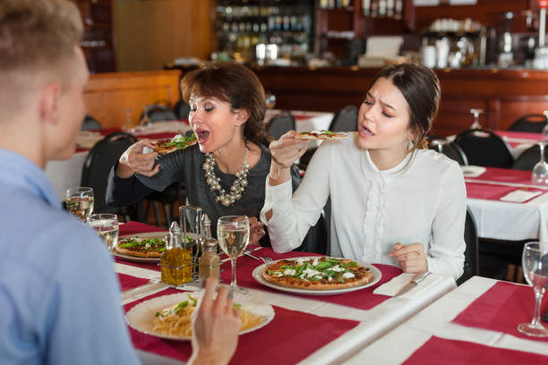 istock Women with man having dinner in restaurant 1080498756
