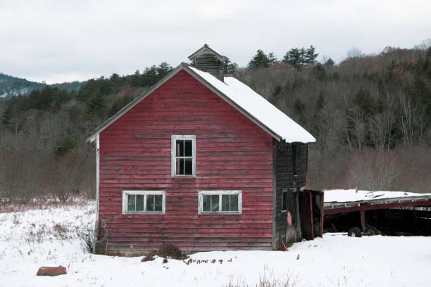 istock Red Barn Winter Landscape 1080499688