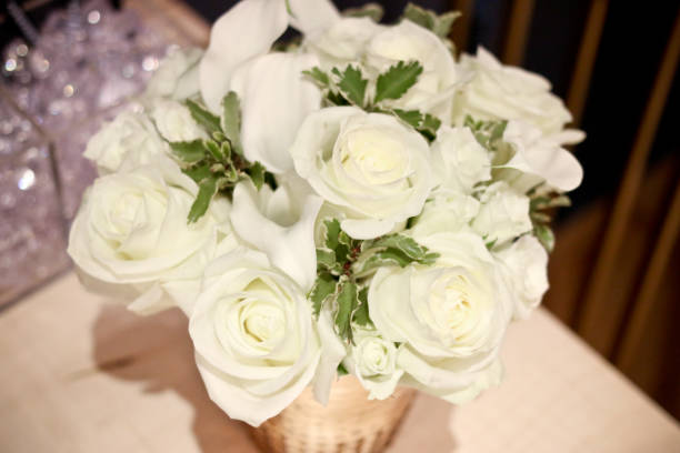 istock bouquet of white roses for wedding reception 1080500210