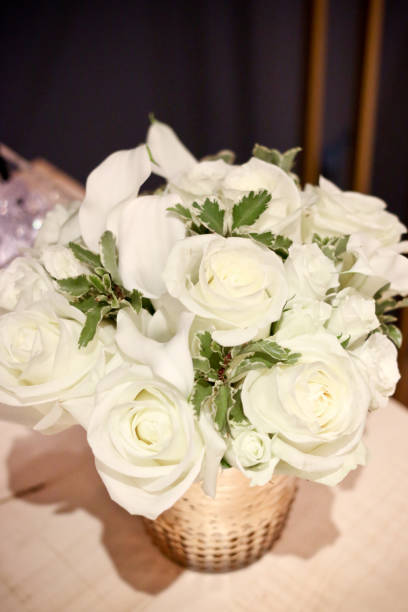 istock bouquet of white roses for wedding reception 1080500254